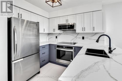 823 - 250 Manitoba Street, Toronto, ON - Indoor Photo Showing Kitchen With Double Sink