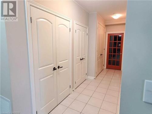 Hallway to den featuring multiple closets - 383 Main Street E Unit# 315, Milton, ON - Indoor Photo Showing Other Room