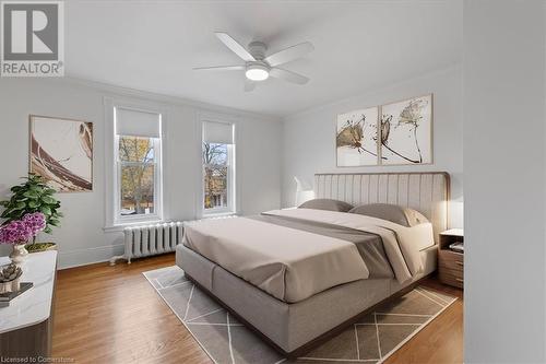 Bedroom 2 with ornamental molding, radiator, and ceiling fan - 635 Laurel Street Unit# Upper Unit, Cambridge, ON - Indoor Photo Showing Bedroom