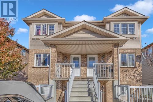 View of front of property with covered porch - 50 Howe Drive Unit# 17B, Kitchener, ON - Outdoor With Facade