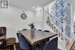 Dining area featuring light tile patterned floors - 