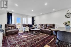 Living room featuring hardwood / wood-style floors - 