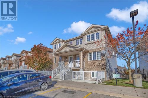 View of front of home featuring a porch - 50 Howe Drive Unit# 17B, Kitchener, ON - Outdoor