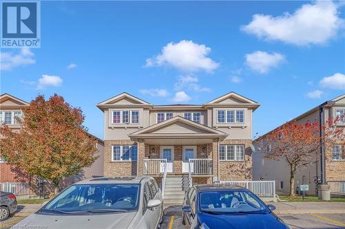 Townhome / multi-family property featuring covered porch - 50 Howe Drive Unit# 17B, Kitchener, ON - Outdoor With Facade