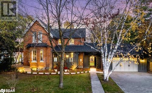 View of front of home with a garage and a yard - 42 Burton Avenue, Barrie, ON - Outdoor