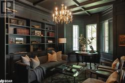 Sitting room featuring crown molding, coffered ceiling, hardwood / wood-style flooring, beamed ceiling, and a chandelier - 