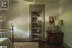 Bedroom featuring dark hardwood / wood-style flooring and lofted ceiling - 