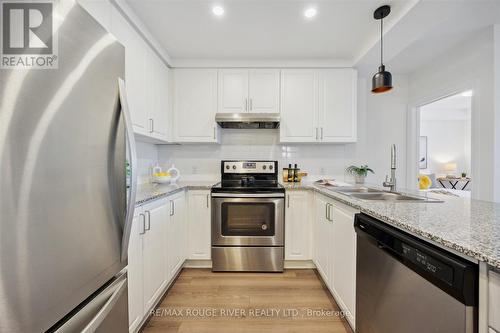 312 - 21 Brookhouse Drive, Clarington (Newcastle), ON - Indoor Photo Showing Kitchen With Stainless Steel Kitchen With Double Sink With Upgraded Kitchen