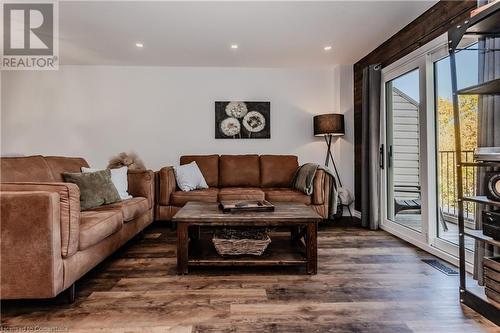 Living room featuring a healthy amount of sunlight and dark hardwood / wood-style floors - 230 Blackhorne Drive Unit# 19, Kitchener, ON - Indoor Photo Showing Living Room