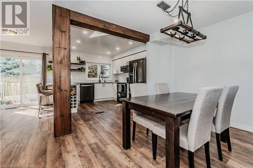 Dining space featuring sink, beamed ceiling, and hardwood / wood-style floors - 230 Blackhorne Drive Unit# 19, Kitchener, ON - Indoor Photo Showing Dining Room