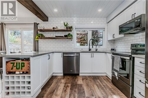 Kitchen with white cabinets, appliances with stainless steel finishes, dark wood-type flooring, and sink - 230 Blackhorne Drive Unit# 19, Kitchener, ON - Indoor Photo Showing Kitchen With Upgraded Kitchen