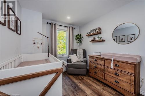 Bedroom with a crib and dark hardwood / wood-style floors - 230 Blackhorne Drive Unit# 19, Kitchener, ON - Indoor