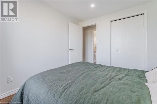 Bedroom with a closet and hardwood / wood-style flooring - 230 Blackhorne Drive Unit# 19, Kitchener, ON - Indoor Photo Showing Bedroom