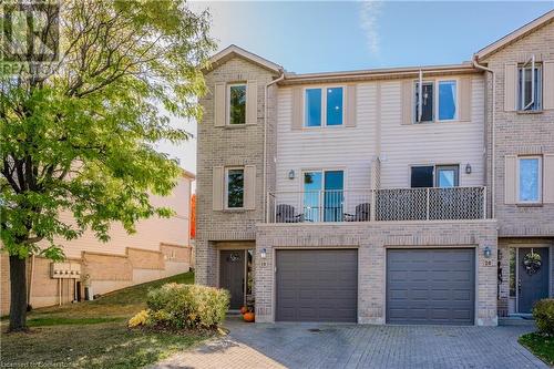 Multi unit property featuring a garage - 230 Blackhorne Drive Unit# 19, Kitchener, ON - Outdoor With Facade