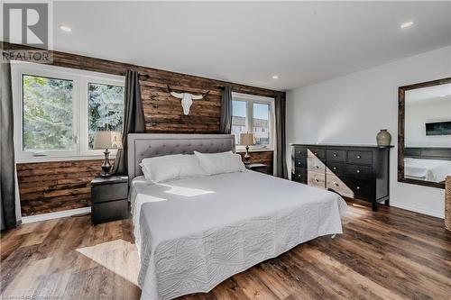 Bedroom with dark hardwood / wood-style flooring and multiple windows - 230 Blackhorne Drive Unit# 19, Kitchener, ON - Indoor Photo Showing Bedroom