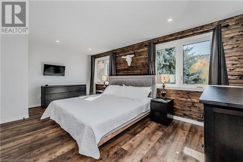 Bedroom with wooden walls and dark hardwood / wood-style floors - 230 Blackhorne Drive Unit# 19, Kitchener, ON - Indoor Photo Showing Bedroom