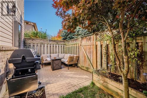 View of patio with an outdoor hangout area and grilling area - 230 Blackhorne Drive Unit# 19, Kitchener, ON - Outdoor With Deck Patio Veranda With Exterior