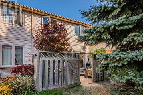 View of home's exterior with a wooden deck - 230 Blackhorne Drive Unit# 19, Kitchener, ON - Outdoor