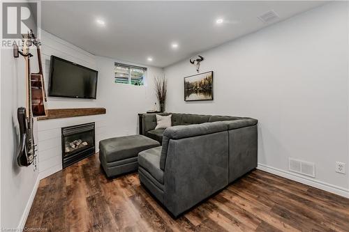 Living room with dark hardwood / wood-style flooring - 230 Blackhorne Drive Unit# 19, Kitchener, ON - Indoor With Fireplace