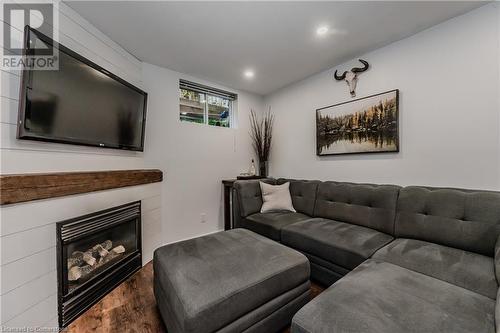 Living room featuring dark hardwood / wood-style floors - 230 Blackhorne Drive Unit# 19, Kitchener, ON - Indoor Photo Showing Living Room With Fireplace