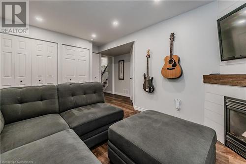 Living room with dark hardwood / wood-style flooring - 230 Blackhorne Drive Unit# 19, Kitchener, ON - Indoor Photo Showing Other Room With Fireplace