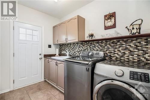 Mudroom with laundry, garage access, side door access - 807 Brissac Way, Ottawa, ON - Indoor Photo Showing Laundry Room