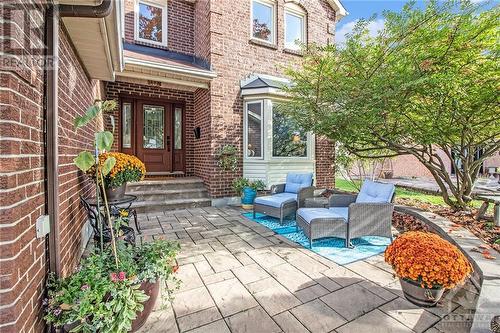 From the moment you arrive, you're greeted by meticulous landscaping and a welcoming covered porch. - 807 Brissac Way, Ottawa, ON - Outdoor