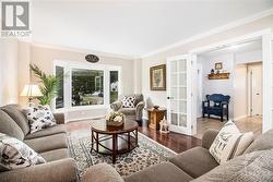 Living room with French door entry and large bay window - 