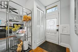 Entryway featuring hardwood / wood-style flooring and ceiling fan - 