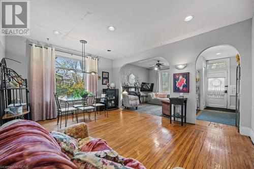 Living room with hardwood / wood-style flooring and ceiling fan - 55 Edgehill Drive, Guelph, ON - Indoor Photo Showing Living Room