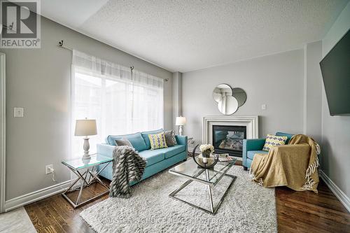 3315 Ruth Fertel Drive, Mississauga, ON - Indoor Photo Showing Living Room With Fireplace