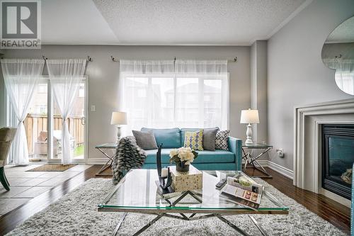 3315 Ruth Fertel Drive, Mississauga, ON - Indoor Photo Showing Living Room With Fireplace