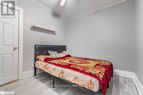 Bedroom featuring hardwood / wood-style flooring and ceiling fan - 77 Province Street N, Hamilton, ON - Indoor Photo Showing Bedroom