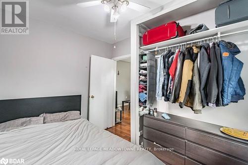 Bedroom featuring hardwood / wood-style floors, ceiling fan, and a closet - 77 Province Street N, Hamilton, ON - Indoor Photo Showing Bedroom