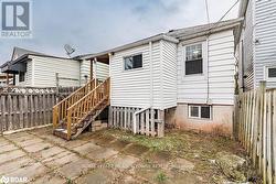 Rear view of property featuring a patio area - 