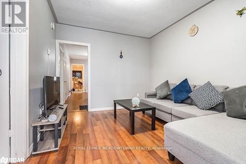 Living room with hardwood / wood-style flooring - 77 Province Street N, Hamilton, ON - Indoor Photo Showing Living Room