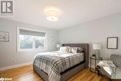 Bedroom featuring light hardwood / wood-style floors - 