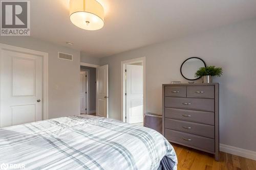 Bedroom with light hardwood / wood-style floors - 1647 Lakeside Drive, Hillier, ON - Indoor Photo Showing Bedroom