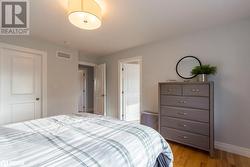 Bedroom with light hardwood / wood-style floors - 