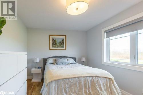 Bedroom with light wood-type flooring - 1647 Lakeside Drive, Hillier, ON - Indoor Photo Showing Bedroom