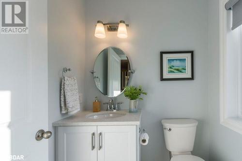 Bathroom featuring toilet and vanity - 1647 Lakeside Drive, Hillier, ON - Indoor Photo Showing Bathroom