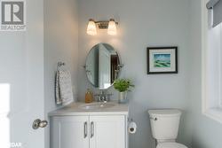 Bathroom featuring toilet and vanity - 