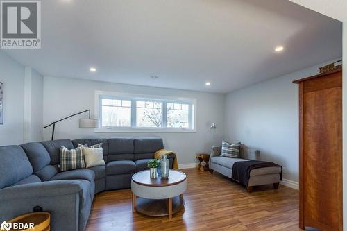 Living room with dark hardwood / wood-style flooring - 1647 Lakeside Drive, Hillier, ON - Indoor Photo Showing Living Room