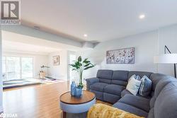 Living room featuring wood-type flooring - 