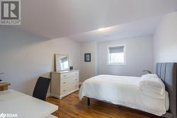 Bedroom featuring dark hardwood / wood-style floors - 