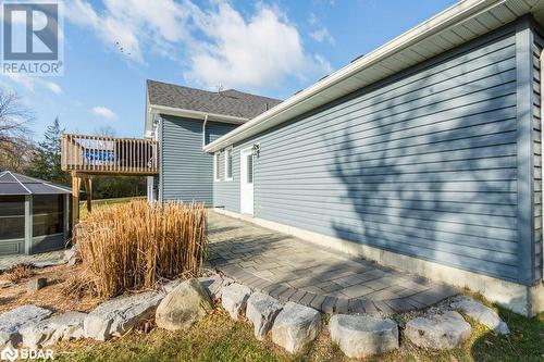 View of home's exterior with a patio - 1647 Lakeside Drive, Hillier, ON - Outdoor