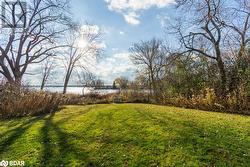 View of yard featuring a water view - 