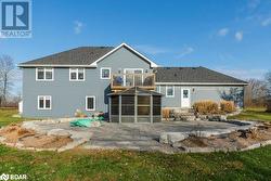 Rear view of house with a balcony and a patio area - 