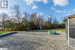 View of patio with a storage shed - 