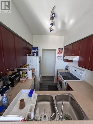 Ph-103 - 38 Lee Centre Drive, Toronto, ON - Indoor Photo Showing Kitchen With Double Sink